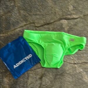 Addicted Brands Green Swim Trunks Vibrant Athletic Design